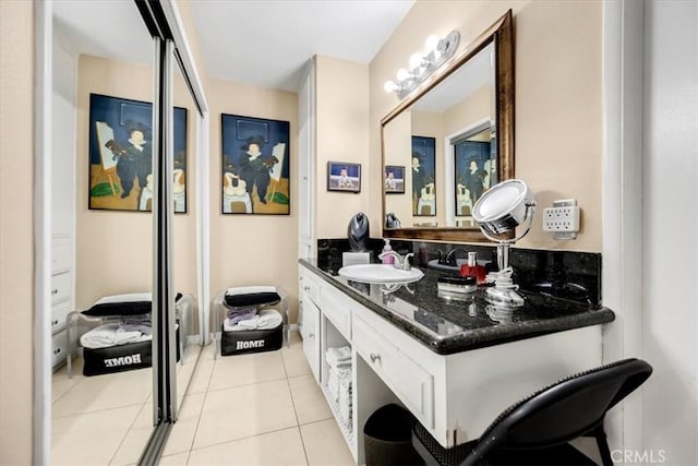 bathroom with tile patterned floors and vanity