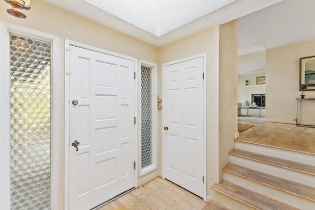 foyer entrance with light wood-type flooring