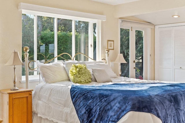 bedroom with a closet and multiple windows