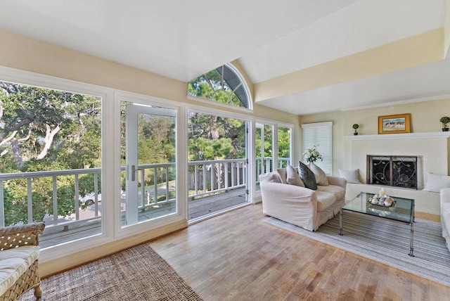 sunroom featuring lofted ceiling