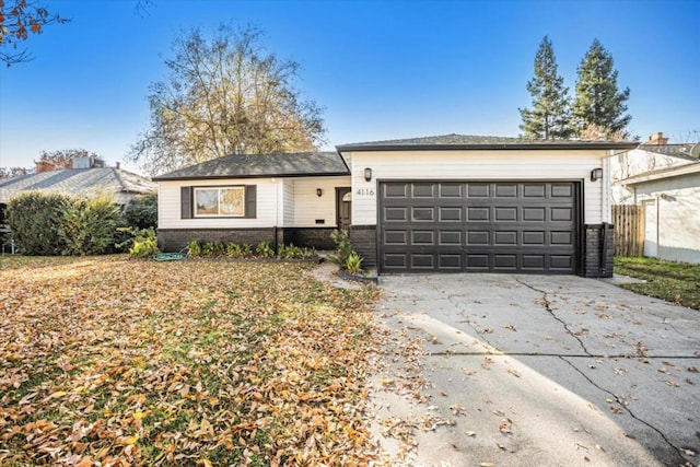 ranch-style home featuring a garage