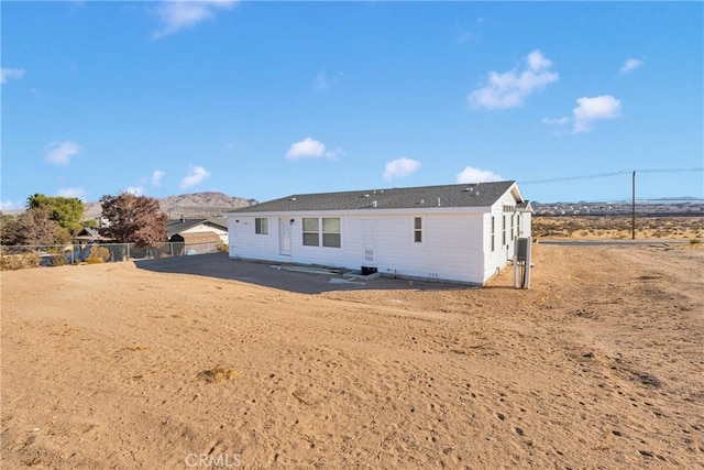 rear view of house with a mountain view