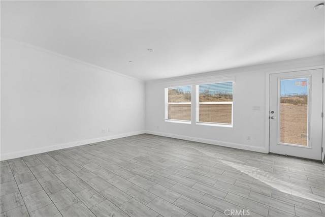 unfurnished room featuring light hardwood / wood-style floors and a healthy amount of sunlight