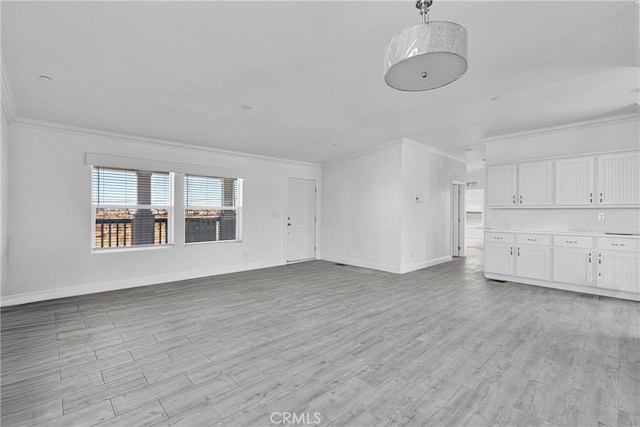 unfurnished living room with light hardwood / wood-style flooring and ornamental molding