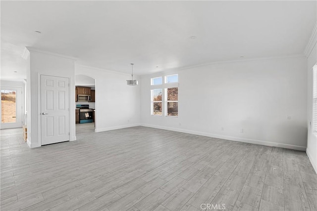 unfurnished living room featuring light hardwood / wood-style flooring and crown molding