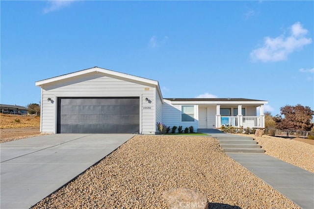 ranch-style house with a porch and a garage