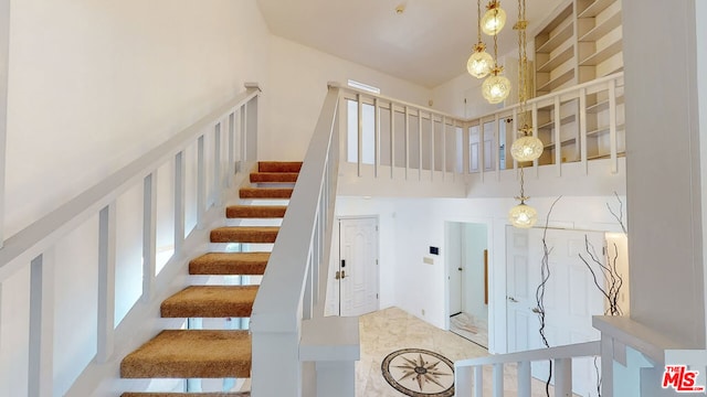 stairway with a towering ceiling