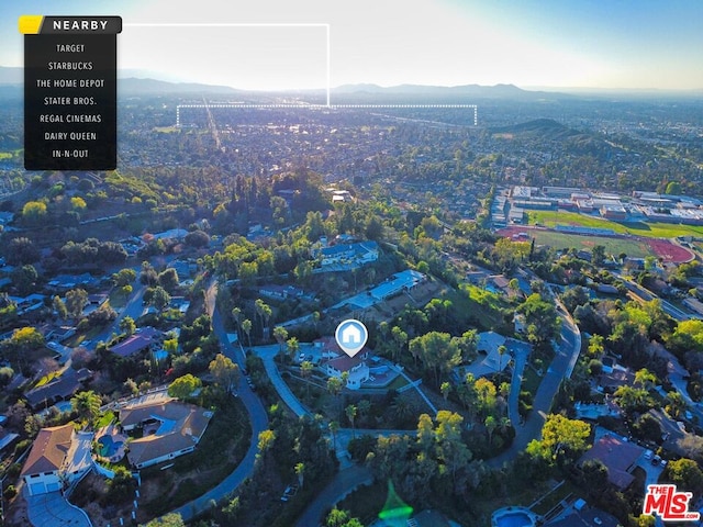 birds eye view of property featuring a mountain view