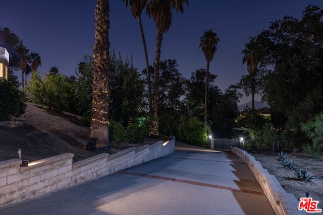 view of pool at night