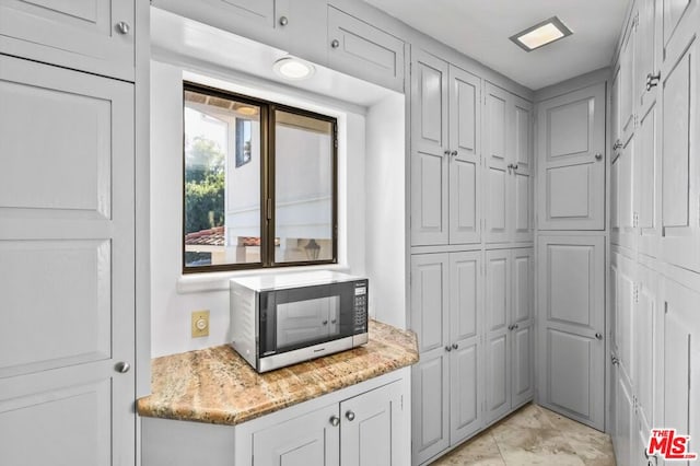 interior space with light stone countertops