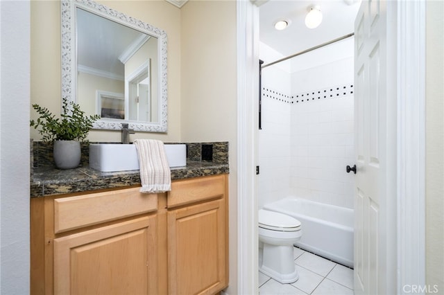 full bathroom featuring tile patterned flooring, washtub / shower combination, vanity, toilet, and crown molding