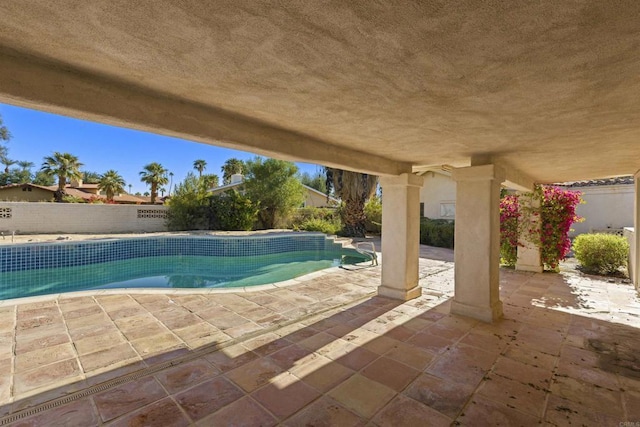 view of swimming pool featuring a patio area