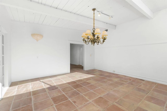 tiled empty room with beam ceiling and a notable chandelier