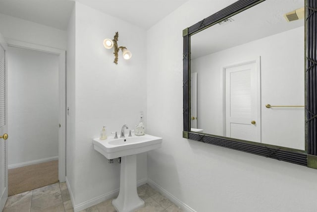 bathroom with tile patterned flooring