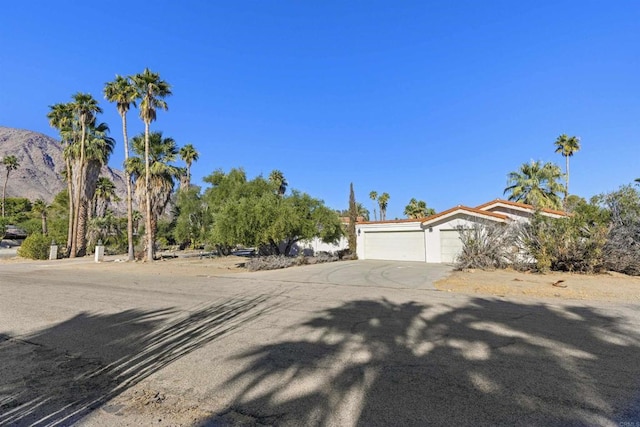 view of front of house with a mountain view and a garage