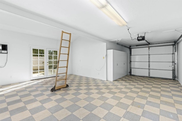 garage with a garage door opener and french doors