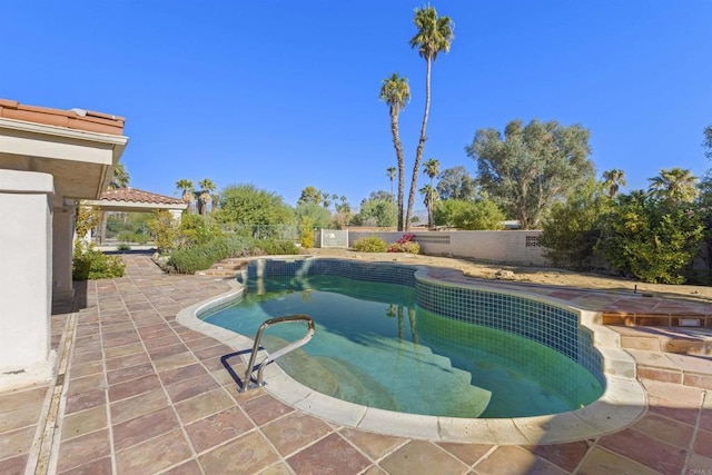 view of swimming pool with a patio area