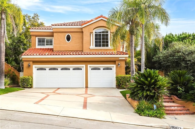 mediterranean / spanish-style house featuring a garage