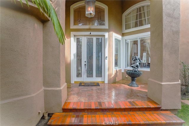 property entrance featuring french doors