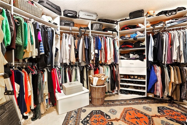 spacious closet with tile patterned floors