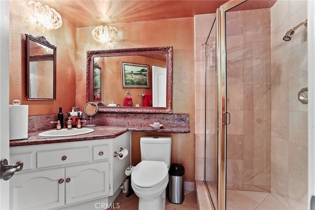 bathroom featuring vanity, toilet, and walk in shower