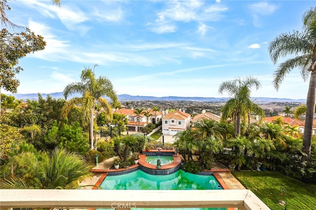 view of swimming pool featuring a mountain view