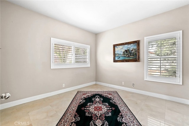 unfurnished room with light tile patterned floors