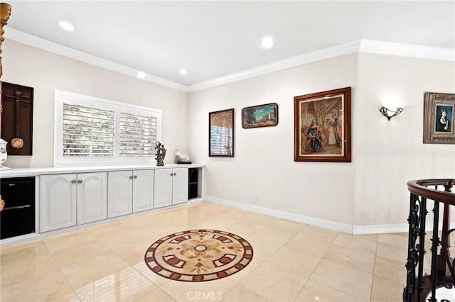 interior space with ornamental molding and light tile patterned flooring