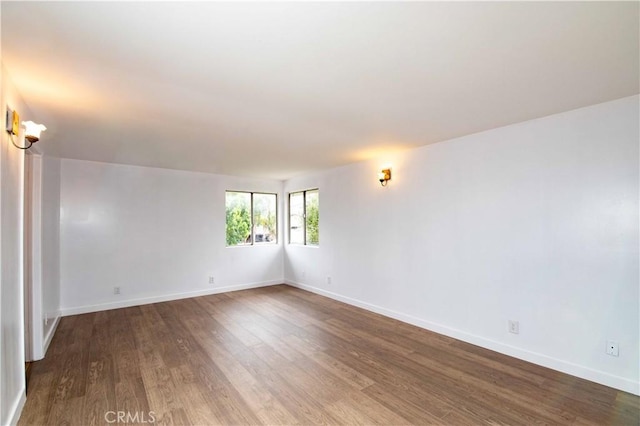 empty room featuring hardwood / wood-style flooring