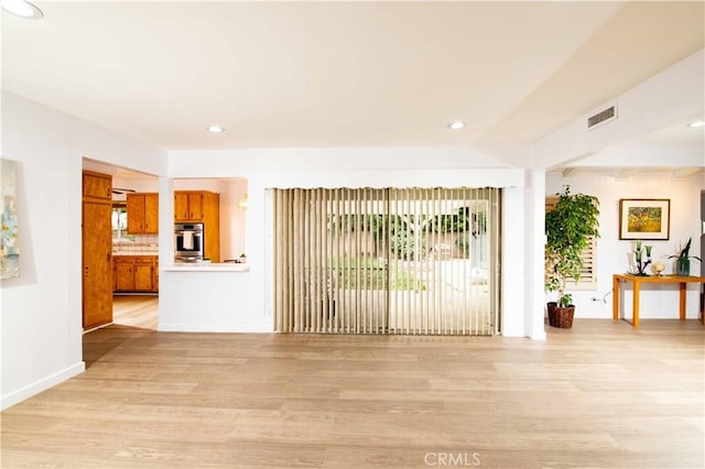 unfurnished living room with light hardwood / wood-style flooring