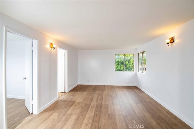 spare room featuring light hardwood / wood-style floors