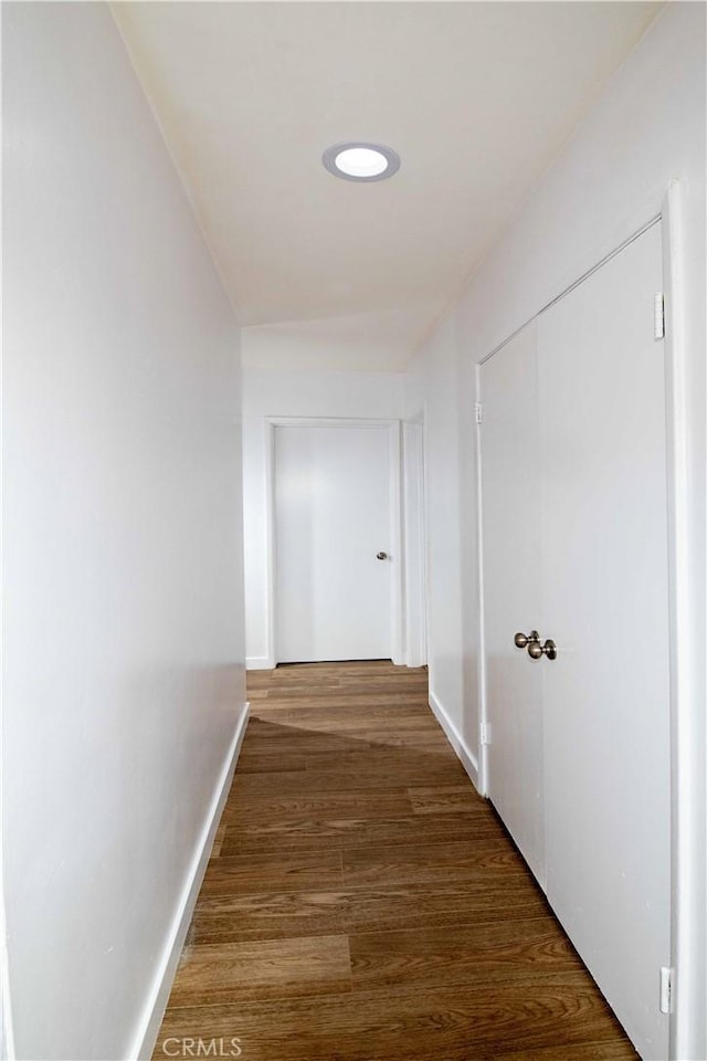 corridor featuring wood-type flooring