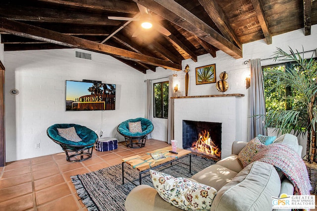 living room featuring vaulted ceiling with beams, plenty of natural light, tile patterned floors, and wooden ceiling