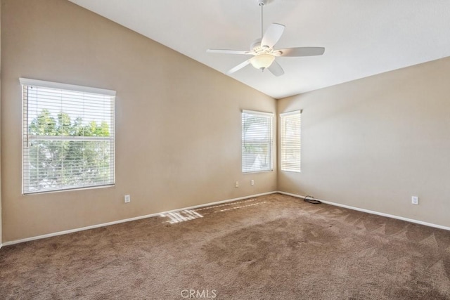 carpeted spare room with vaulted ceiling and ceiling fan