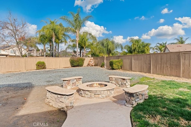 view of yard with a patio and a fire pit