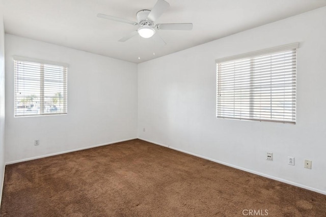 carpeted empty room with ceiling fan