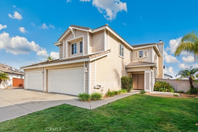 view of front property with a garage and a front lawn