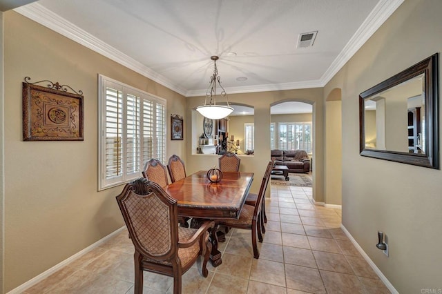 tiled dining space with crown molding