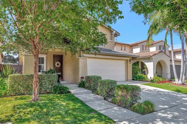 view of front of property with a front lawn and a garage