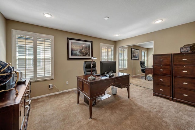 office featuring light carpet and a wealth of natural light