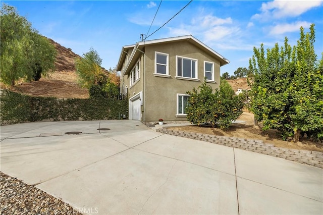 view of property exterior featuring a garage