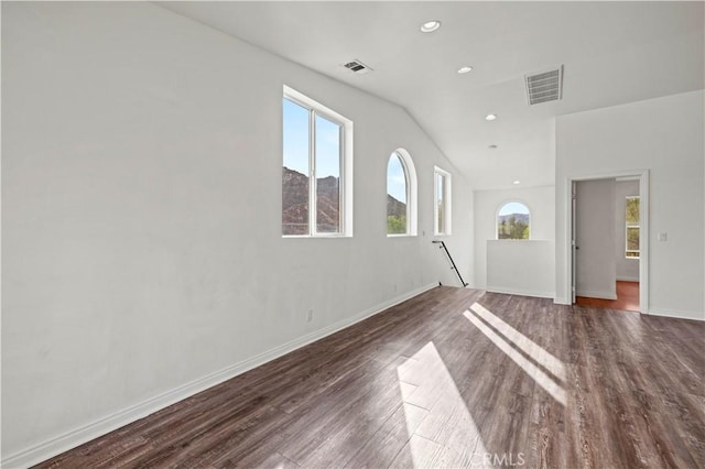 unfurnished living room with lofted ceiling and dark hardwood / wood-style flooring