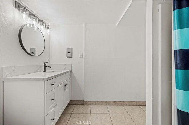 bathroom featuring vanity, tile patterned flooring, and walk in shower