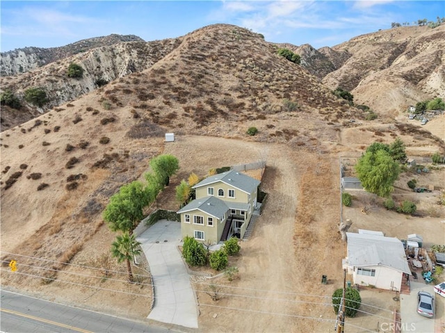 birds eye view of property featuring a mountain view