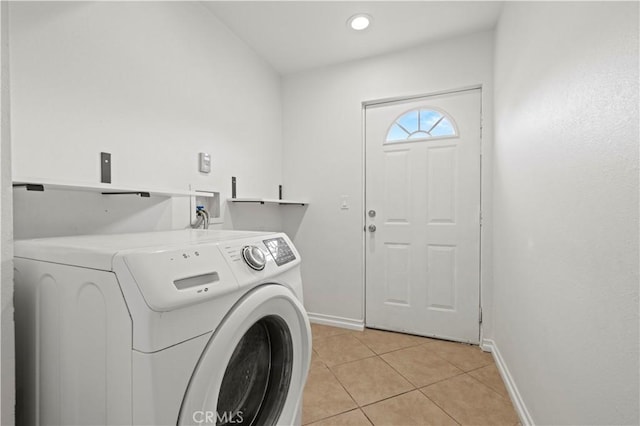 clothes washing area with light tile patterned floors and washer hookup