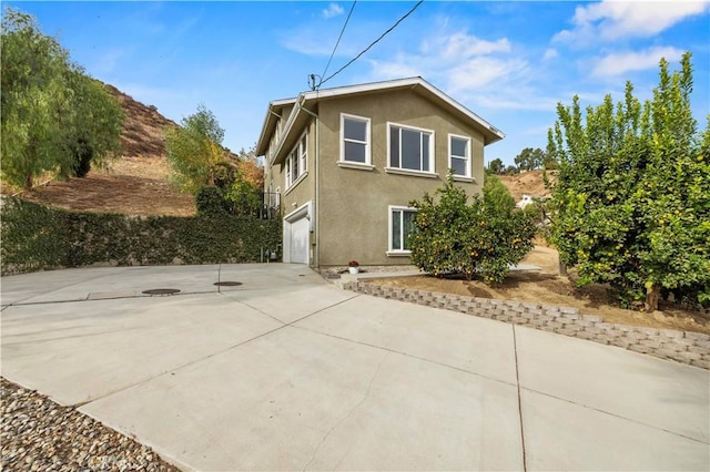 view of property exterior with a garage