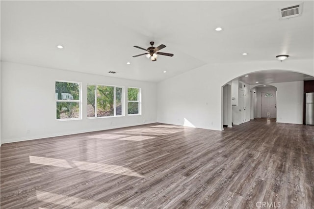 unfurnished living room featuring ceiling fan, hardwood / wood-style floors, and vaulted ceiling