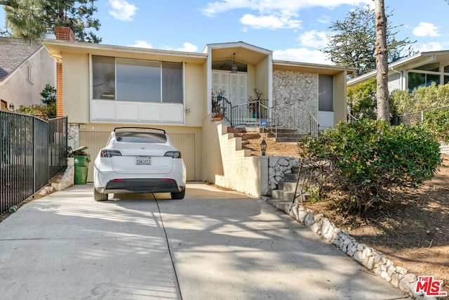 view of front of property featuring a garage