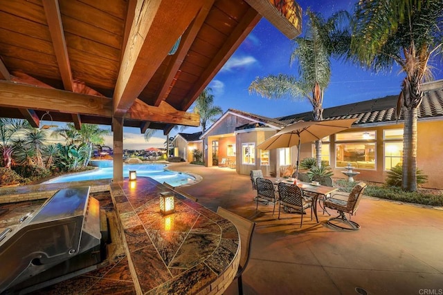 view of patio terrace at dusk