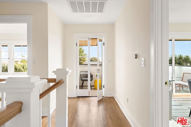 doorway to outside with hardwood / wood-style flooring